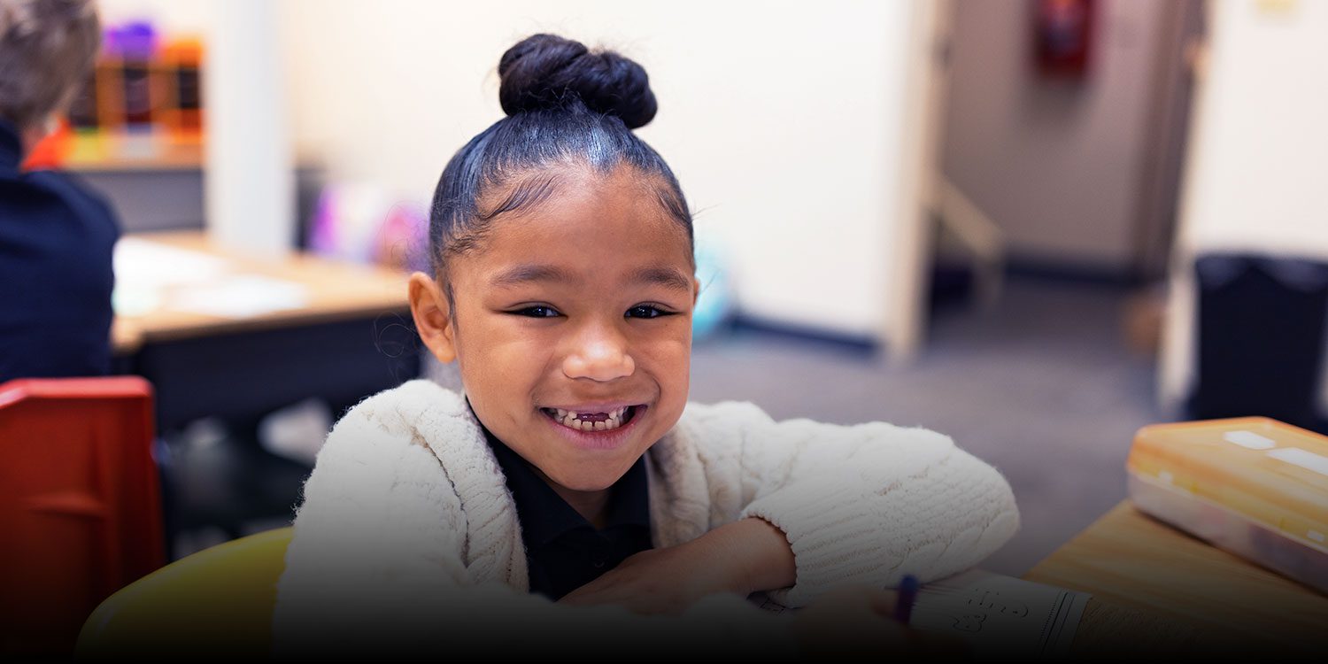 Smiling student in the classroom