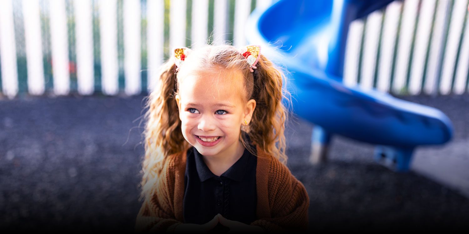 Smiling student on the playing field